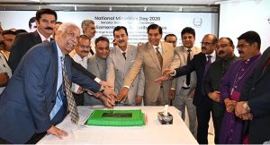 Chairman Senate, Syed Yousuf Raza Gilani along with distinguished guests, cutting a cake during a ceremony held in connection with National Minorities day at Parliament House