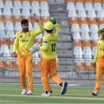 Pakistan Greens cricket fielders celebrate after dismissing a Pakistan Whites batter during the National Champions Cup 2026–27 match at Multan Cricket Stadium