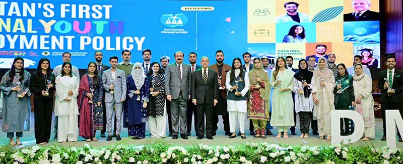 Prime Minister Muhammad Shehbaz Sharif in a group photo with high achievers at the International Youth Day Ceremony