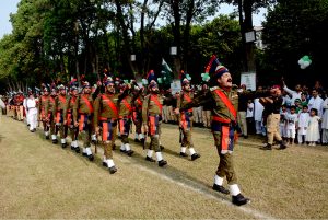 Police personnel march past during a flag hoisting ceremony organized in Commissioner Complex to celebrate Independence Day