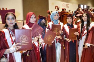 Sindh Minister for Universities and Boards Department Muhammad Ismail Rahoo awards a degree to a successful graduate during the third convocation of Government College University, Hyderabad