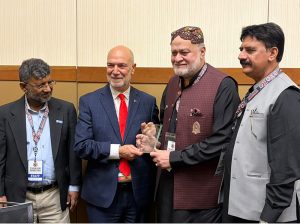CEO Zakat foundation of America Halil Damir presenting a shield to Federal Minister to Syed Imran Ahmad Shah after the Turkish Festival.