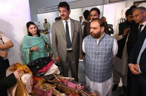 Federal Minister for National Heritage and Culture Aurangzeb Khan Khichi visits the stalls at the launching ceremony of "Naqoosh-i-Watan" a national cultural narrative at PNCA.