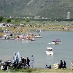 A large number of people visit Khanpur Lake on the eve of Independence Day celebrations marking in the country