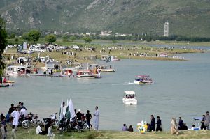 A large number of people visit Khanpur Lake on the eve of Independence Day celebrations marking in the country