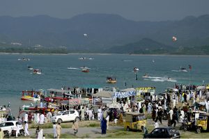 A large number of people visit Khanpur Lake on the eve of Independence Day celebrations marking in the country