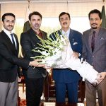 Chairman and Editor-in-Chief of Pakistan Observer Faisal Zahid Malik presents a bouquet to Chairman Senate Syed Yousuf Raza Gilani at Parliament House