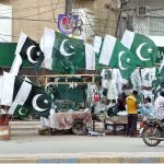 Vendors display national flags, badges and other Independence Day-themed items as the nation prepares to celebrate Independence Day with patriotic fervor in the provincial capital