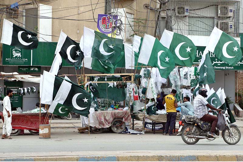 Vendors display national flags, badges and other Independence Day-themed items as the nation prepares to celebrate Independence Day with patriotic fervor in the provincial capital