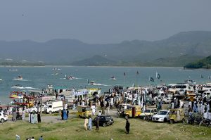 A large number of people visit Khanpur Lake on the eve of Independence Day celebrations marking in the country