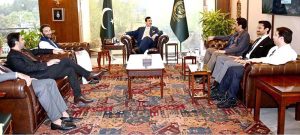 Chairman and Editor-in-Chief of Pakistan Observer Faisal Zahid Malik presents a bouquet to Chairman Senate Syed Yousuf Raza Gilani at Parliament House