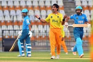 Pakistan Whites batters run between the wickets after playing a shot during the opening match of the National Champions Cup 2026–27 at Multan Cricket Stadium