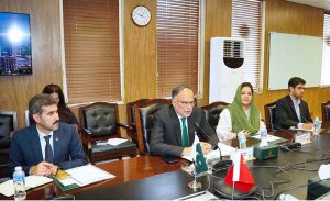 Federal Minister for Planning Ahsan Iqbal in a meeting with Liu Daxiu, Head of delegation and First Class Inspector, Party Building Research Institute, Organization Department of the CPC Central Committee and members of the visiting Chinese delegation