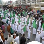 A large number of people participating in main procession of Eid Milad-un-Nabi, the birth anniversary of Holy Prophet Muhammad (PBUH) at M.A Jinnah Road near Numaish Chowrangi