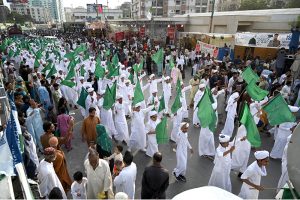A large number of people participating in main procession of Eid Milad-un-Nabi, the birth anniversary of Holy Prophet Muhammad (PBUH) at M.A Jinnah Road near Numaish Chowrangi