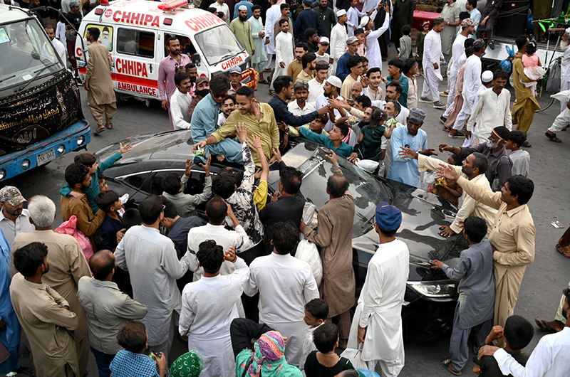 Free food are being distributing among the people participating in main procession of Eid Milad-un-Nabi, the birth anniversary of Holy Prophet Muhammad (PBUH) at M.A Jinnah Road near Numaish Chowrangi