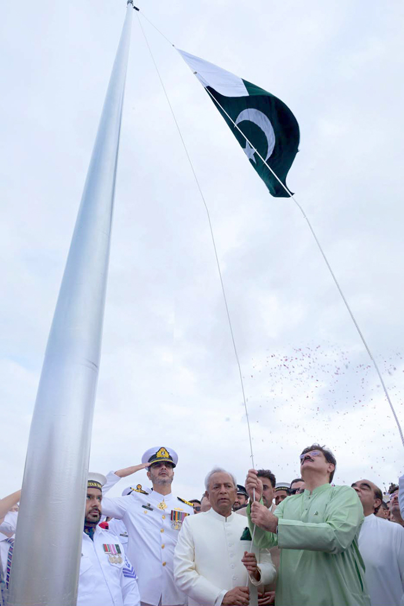 Sindh Chief Minister Syed Murad Ali Shah, accompanied by Governor Sindh Syed Muhammad Nihal Hashmi and members of the provincial cabinet, hoists the national flag at Mazar-e-Quaid during the Independence Day ceremony commemorating Pakistan's 79th Independence Day