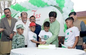 Sindh Chief Minister Syed Murad Ali Shah interacts with a child undergoing rehabilitation from drug addiction during his visit to the Aas Foundation in Haji Sukhio Goth on the occasion of Independence Day