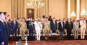 Chairman Senate Syed Yousuf Raza Gilani, Deputy Prime Minister and Foreign Minister Senator Muhammad Ishaq Dar, members of the Federal Cabinet, Chief of Defence Forces Field Marshal Syed Asim Munir, COAS; Chief of the Air Staff, Air Chief Marshal Zaheer Ahmed Baber Sidhu and Chief of the Naval Staff Admiral Naveed Ashraf stand in respect of the National Anthem at a Special Investiture Ceremony held at Aiwan-e-Sadr