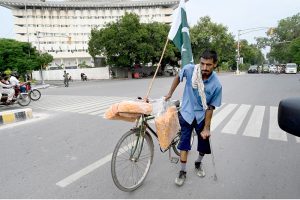 People hold national flag to celebrate the country's Independence Day