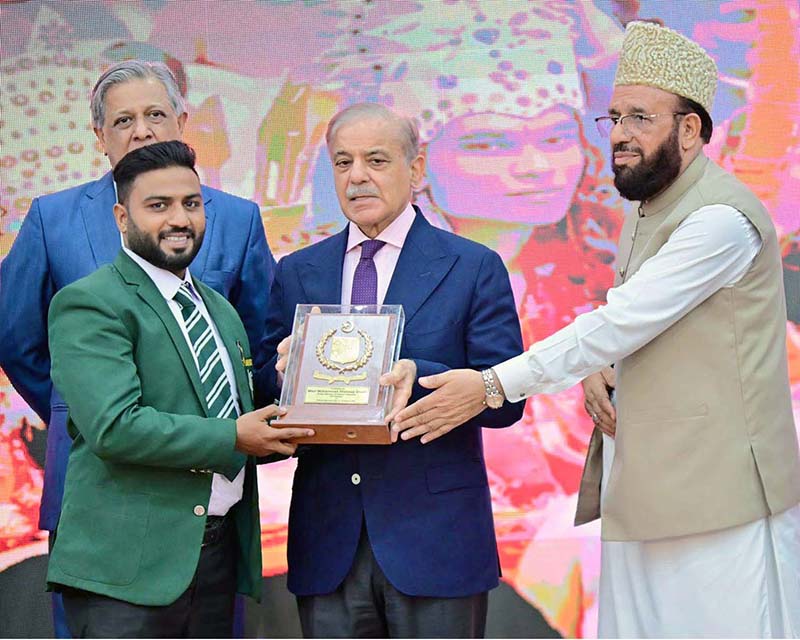 Prime Minister Muhammad Shehbaz Sharif presenting awards to the members of Religious Minorities of Pakistan who contributed towards the sustained benefits of the society