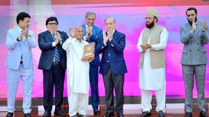 Prime Minister Muhammad Shehbaz Sharif presenting awards to the members of Religious Minorities of Pakistan who contributed towards the sustained benefits of the society