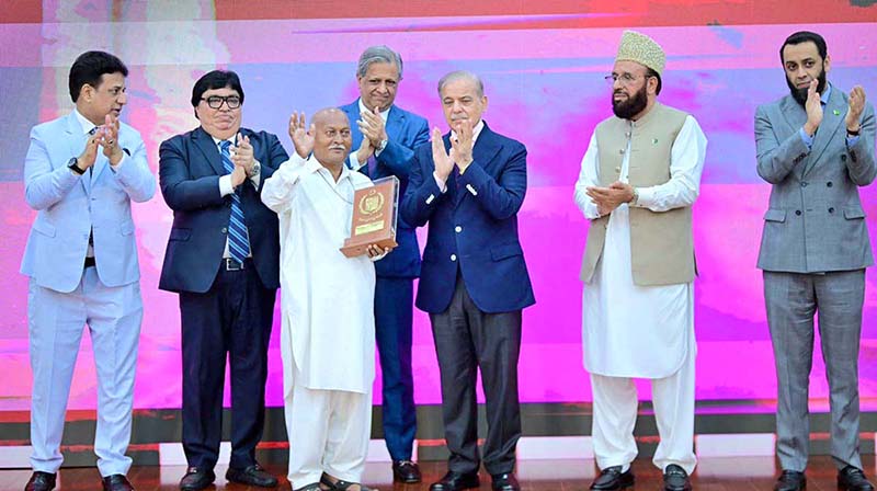 Prime Minister Muhammad Shehbaz Sharif presenting awards to the members of Religious Minorities of Pakistan who contributed towards the sustained benefits of the society