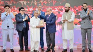 Prime Minister Muhammad Shehbaz Sharif presenting awards to the members of Religious Minorities of Pakistan who contributed towards the sustained benefits of the society