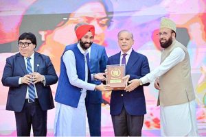 Prime Minister Muhammad Shehbaz Sharif presenting awards to the members of Religious Minorities of Pakistan who contributed towards the sustained benefits of the society