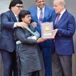 Prime Minister Muhammad Shehbaz Sharif presenting awards to the members of Religious Minorities of Pakistan who contributed towards the sustained benefits of the society