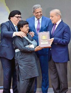 Prime Minister Muhammad Shehbaz Sharif presenting awards to the members of Religious Minorities of Pakistan who contributed towards the sustained benefits of the society