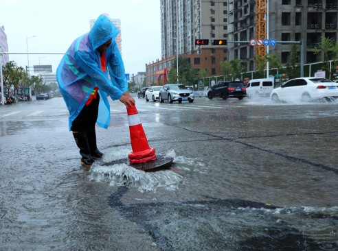Beijing shuts tourist sites, suspends bus routes as rain continues