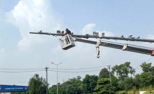 Safe City personnel are repairing a CCTV surveillance camera to maintain the 'Safe City' system located along the Expressway in the federal capital.