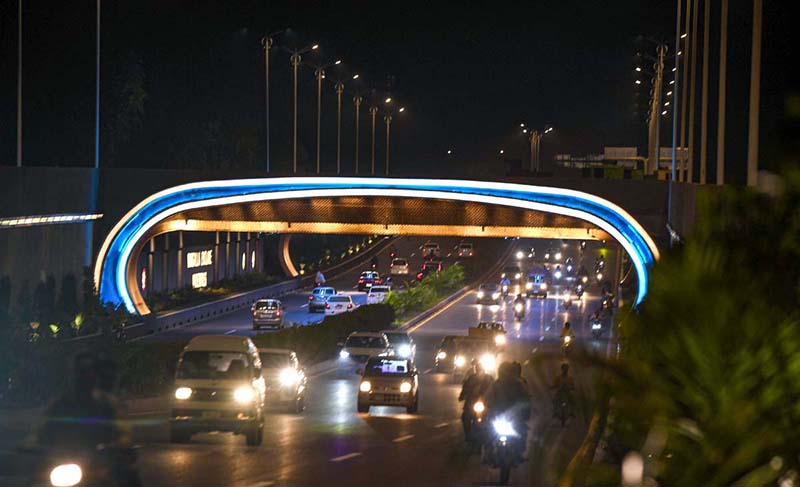 As dawn breaks over the horizon, warm golden light sweeps across Islamabad's freshly paved entry avenues. Pakistan's capital welcomes travelers with a redesigned urban landscape featuring landscaped g