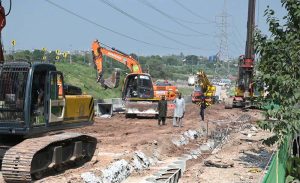 Heavy machinery and construction crews are working on the rehabilitation, expansion, and dualization of the eastern service road along the Islamabad Expressway as part of a Capital Development Authority (CDA) project to upgrade the 9-kilometre stretch from Faizabad Interchange to Gulberg Greens into a six-lane carriageway.