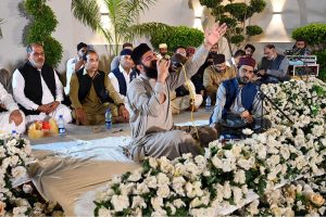 A naat khawan recites during a Mehfil-e-Milad held in Media Town, as attendees listen attentively