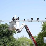 Workers carry out maintenance work on CCTV cameras installed in the Federal Capital