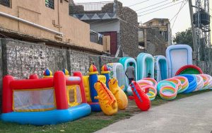 Children’s toys and inflatable swimming pools displayed for sale along Rawal Road in twin cities.
