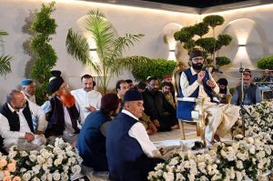 A naat khawan recites during a Mehfil-e-Milad held in Media Town, as attendees listen attentively