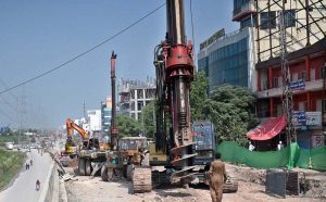Heavy machinery and construction crews are working on the rehabilitation, expansion, and dualization of the eastern service road along the Islamabad Expressway as part of a Capital Development Authority (CDA) project to upgrade the 9-kilometre stretch from Faizabad Interchange to Gulberg Greens into a six-lane carriageway.