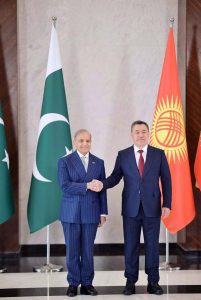 Prime Minister Muhammad Shehbaz Sharif shakes hands with the Kyrgyz President H.E. Sadyr Nurgozhoevich Japarov at the Yntymak-Ordo (Palace of Unity).