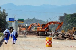 Heavy machinery and labourers work to complete the Park Road Underpass project, which is nearing completion.