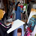 Students learn painting techniques at an art training stall H-9 weekly bazaar in the Federal Capital