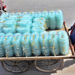 A cart holder on the way, with bangles loaded on the cart to be delivered to the bangles market at Hali Road