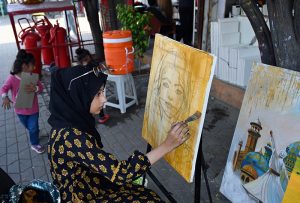 Students learn painting techniques at an art training stall H-9 weekly bazaar in the Federal Capital