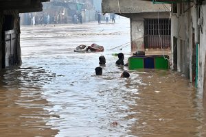 A view of Nullah Leh flowing at a dangerously high level following heavy monsoon rains, as the swollen waterway poses a serious threat to residential areas and settlements built along its banks in the Federal capital.