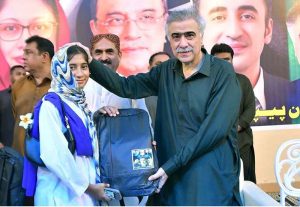 MPA Sardar Sohail Anwar Khan Siyal distributes laptops to students during a ceremony in Fareedabad Village.