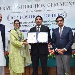 Chairman Education Board Abbash Ahmad Gondal and Vice Chancellor University of Sargodha Prof. Dr. Tasawar Hayyat awarding a gold medal and certificate to a position holder student during prize distribution ceremony of Higher Secondary School Certificate (HSSC) Annual Examination-2026 at Education Board Multipurpose Hall