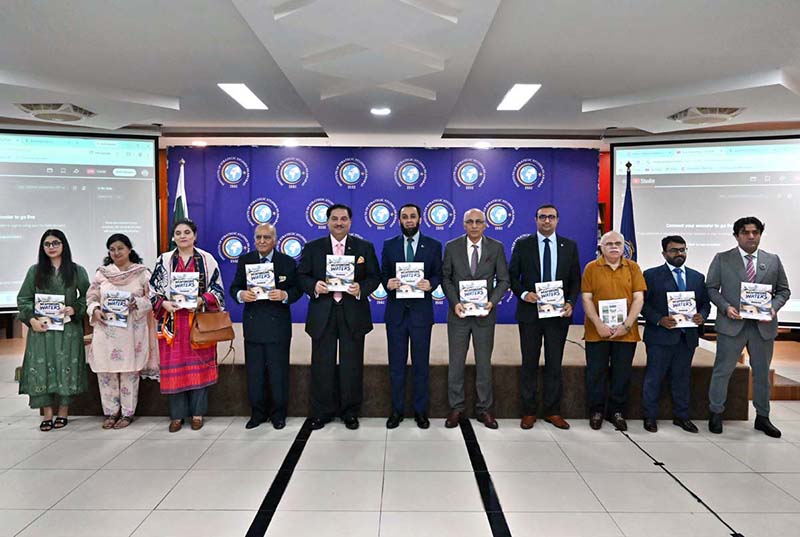 Federal Minister for Information and Broadcasting Attaullah Tarar in a group photograph during launching ceremony of special report titled: “Weaponising Waters: Historical, Legal and Strategic Dimensions of IWT Suspension” at ISSI