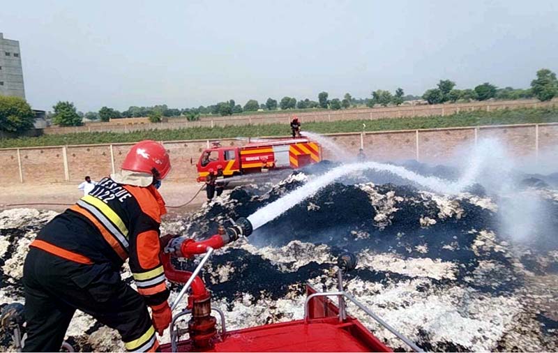 Rescue 1122 firefighters are busy extinguishing a blaze after a pile of around 20 tons of cotton suddenly caught fire at Azam Cotton Factory due to unknown reasons at Yazman Road, 24-BC